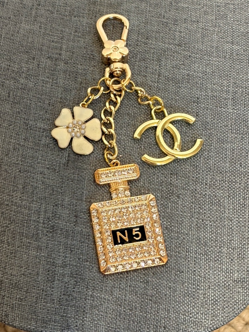 Authentic Chanel CC charm with unbranded, perfume and flower charms on keychain